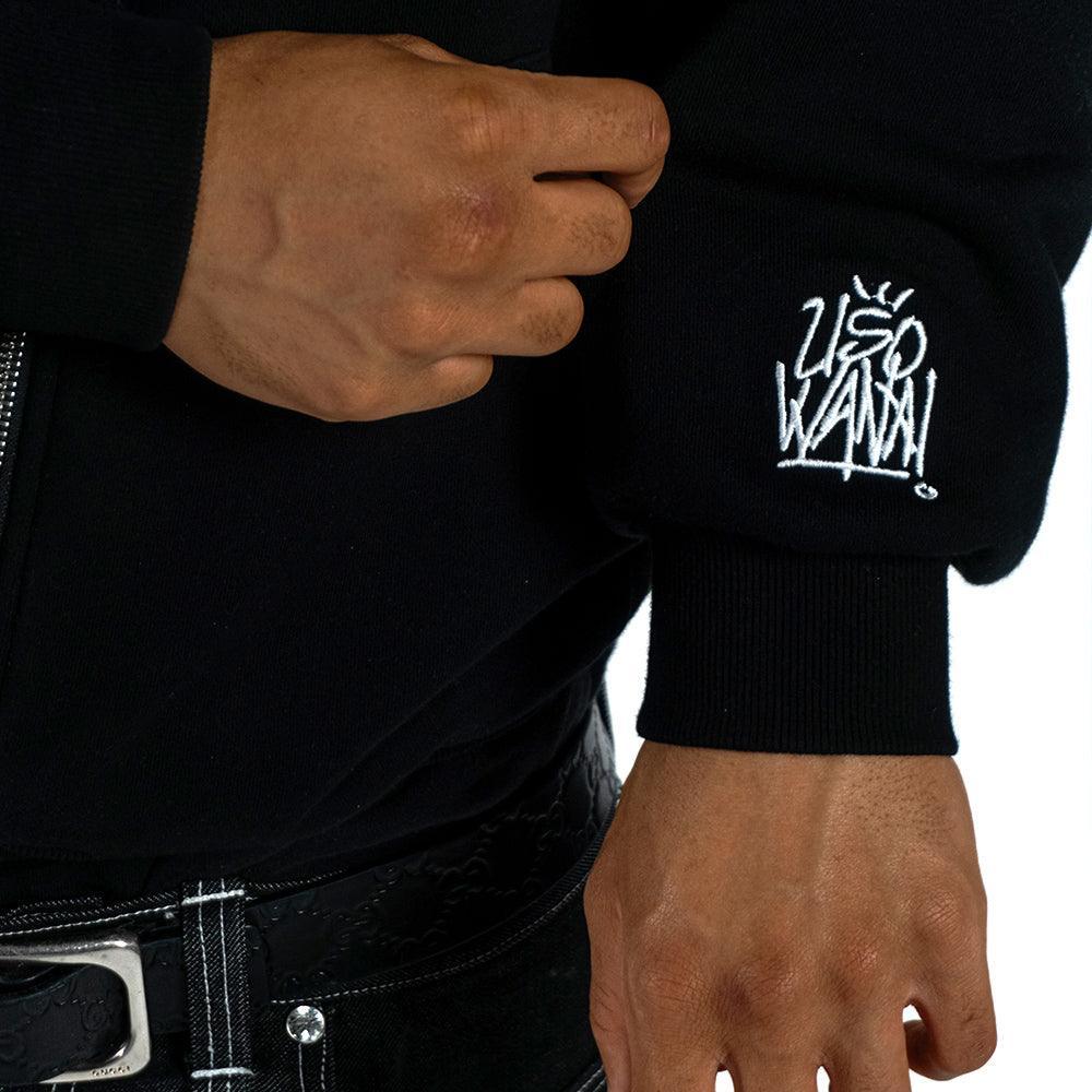 Uso Wanai Red Revel Zip-Up Hoodie sleeve detail showing white embroidered logo on black ribbed cuff of 400 GSM French Terry fabric