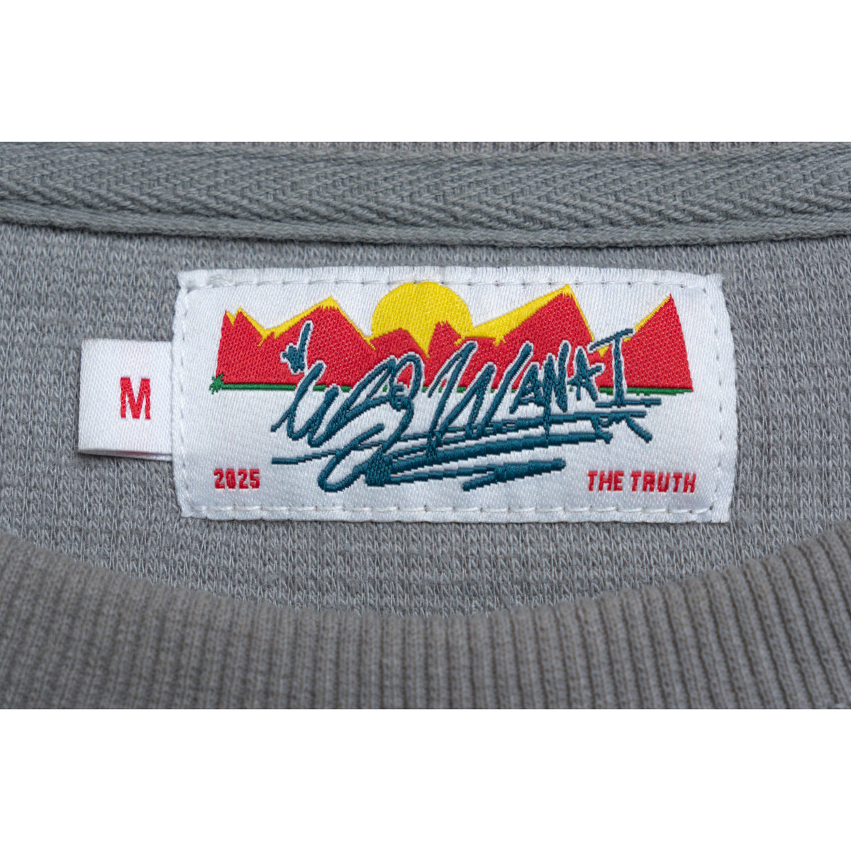 Uso Wanai woven neck label, size M, 2025, The Truth